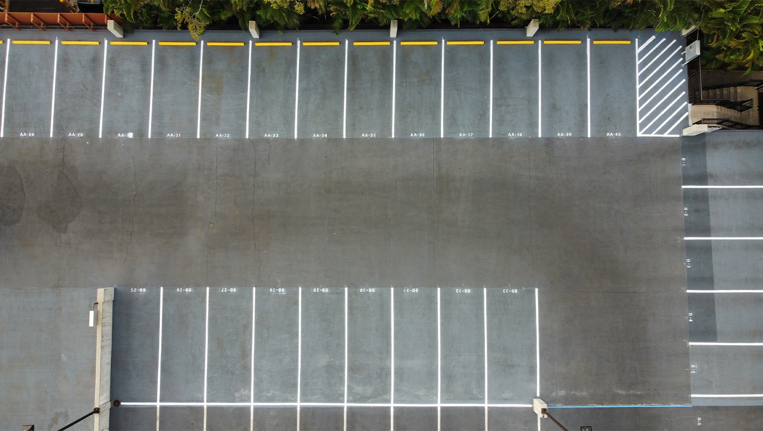 aerial view of parking lot with freshly painted fire lane markings