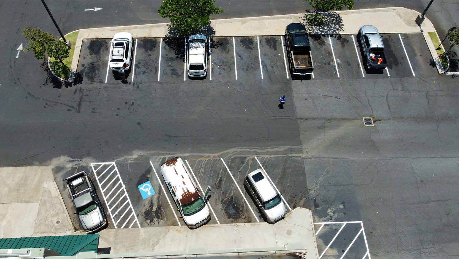 aerial view of O'Reilly Auto Parts parking lot with freshly paitned ada compliance parking spots