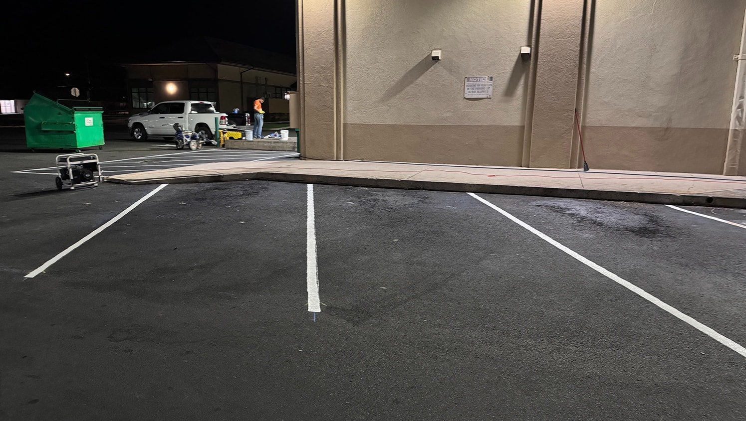 close-up of freshly painted white lines for O'Reilly Auto Parts parking lot